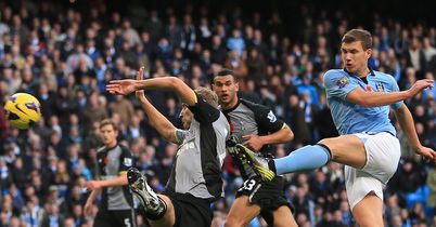 Edin Dzeko strikes late for City